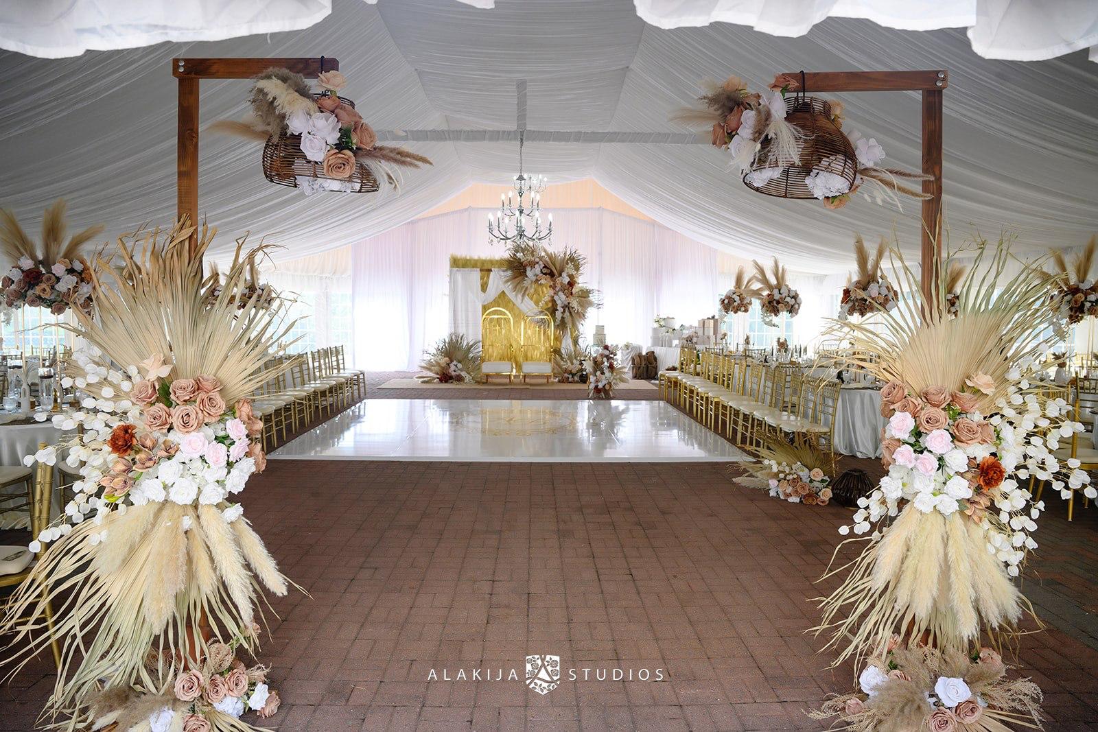 A wedding ceremony with a large white tent.